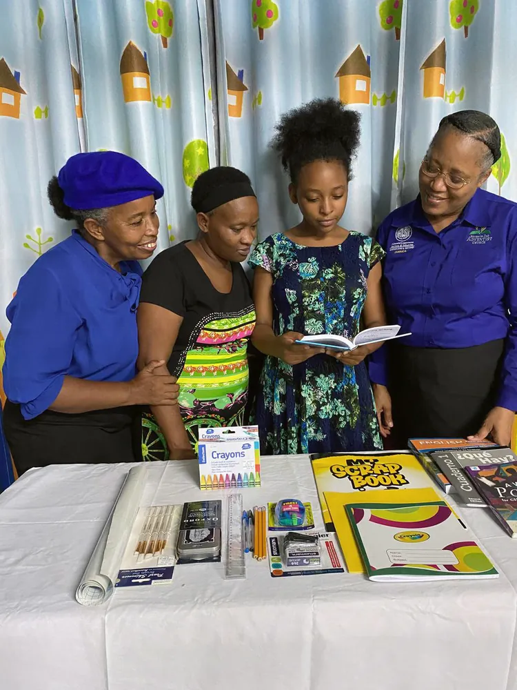 Members sharing books and supplies