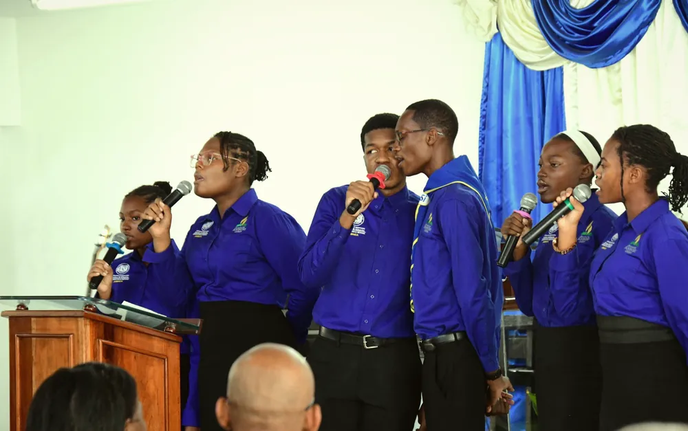Missionaries singing together at the front of the church