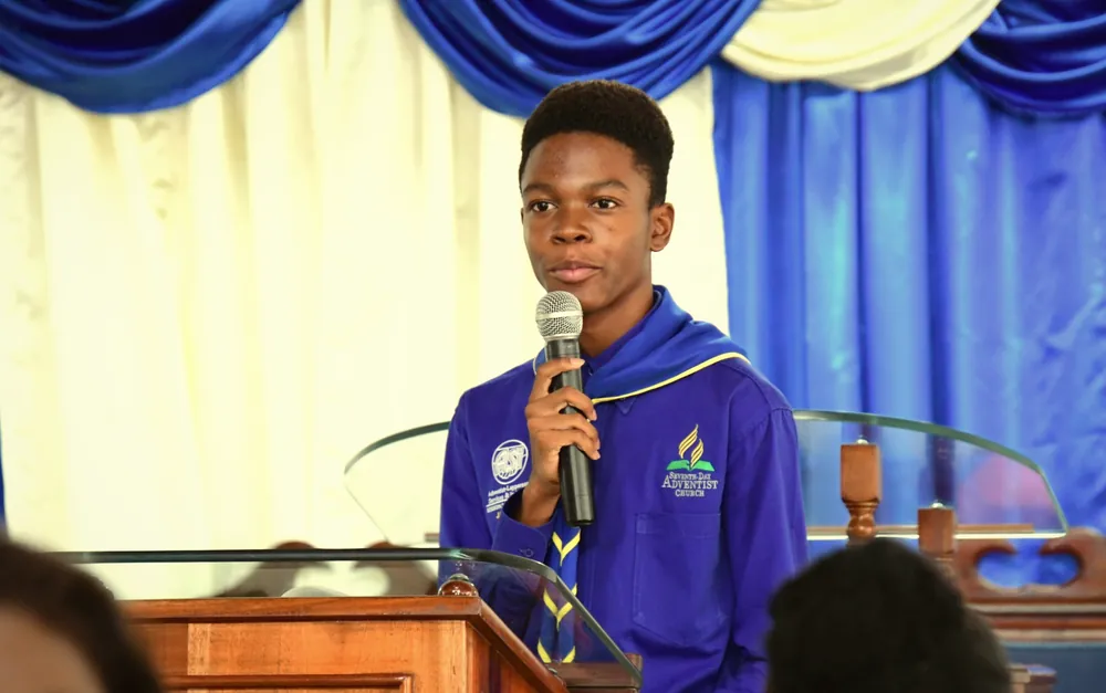 A young missionary speaking at the pulpit