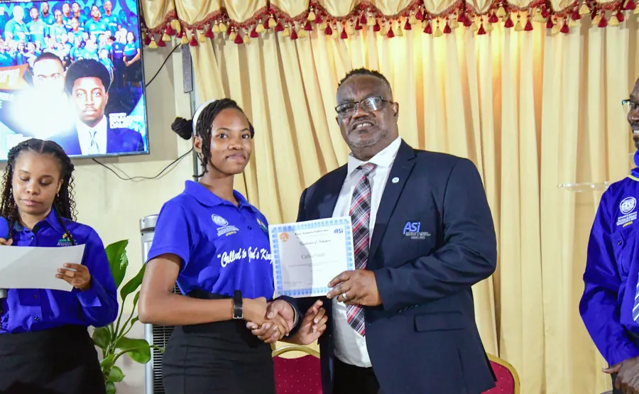 A missionary receives a certificate of induction