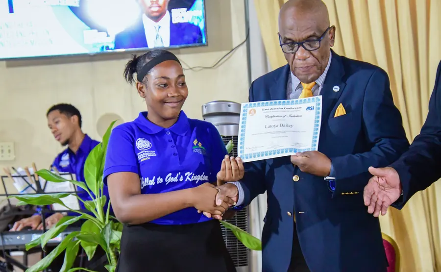 A missionary receives a certificate of induction