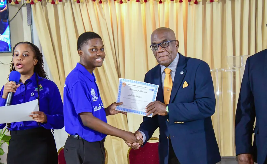A missionary receives a certificate of induction