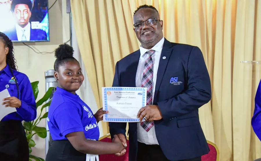 A missionary receives a certificate of induction