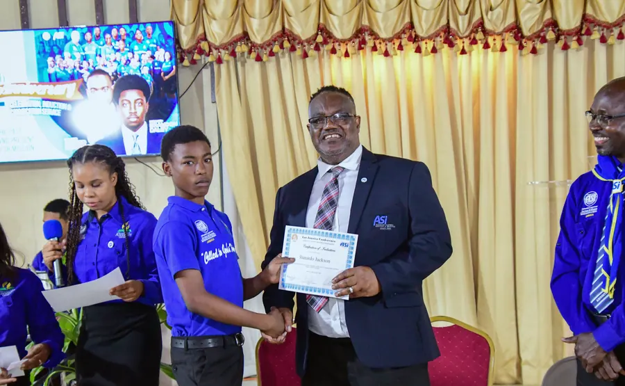 A missionary receives a certificate of induction