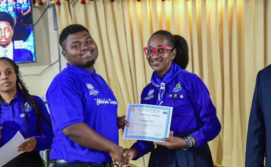 A missionary receives a certificate of induction