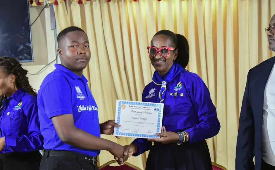 A missionary receives a certificate of induction