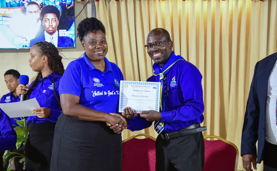 A missionary receives a certificate of induction