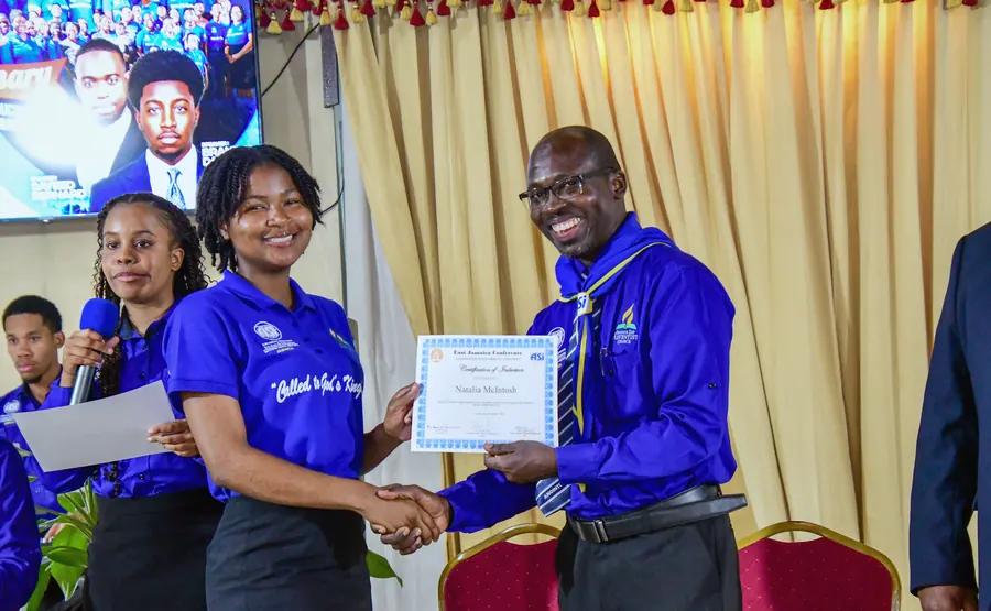 A missionary receives a certificate of induction