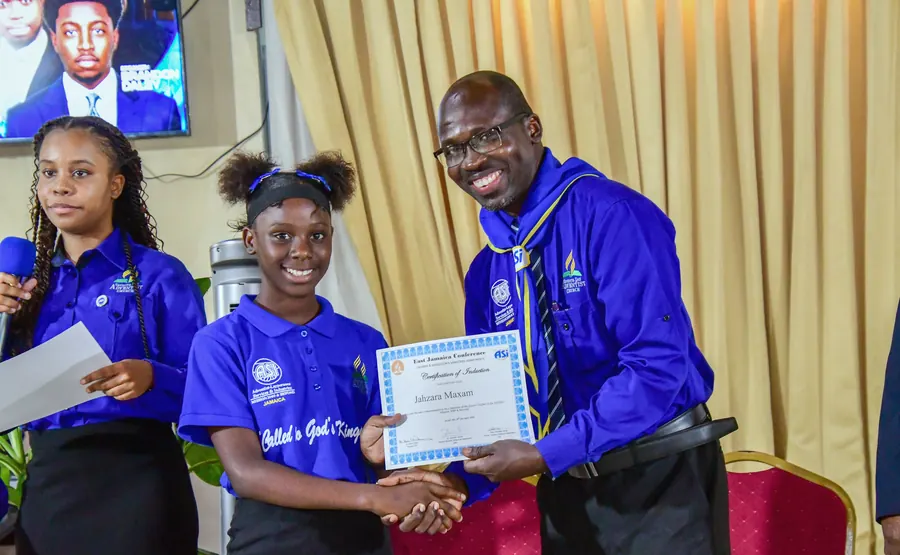 A missionary receives a certificate of induction