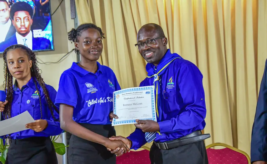 A missionary receives a certificate of induction