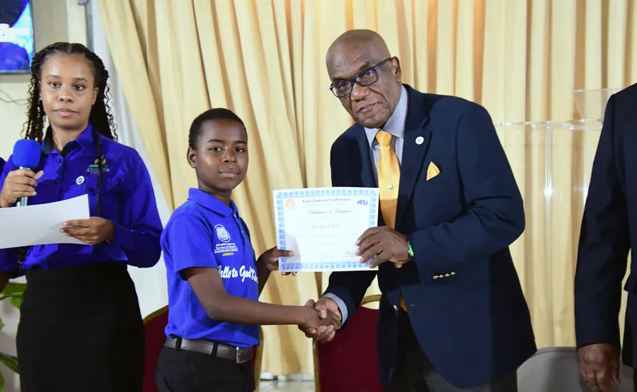 A missionary receives a certificate of induction