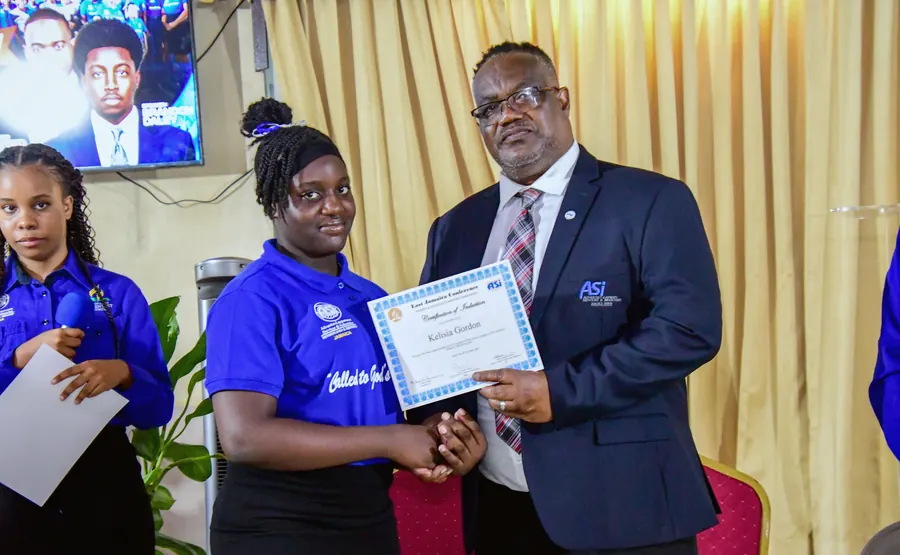 A missionary receives a certificate of induction