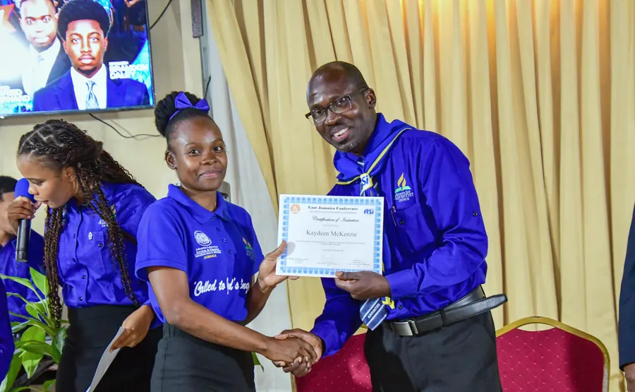 A missionary receives a certificate of induction