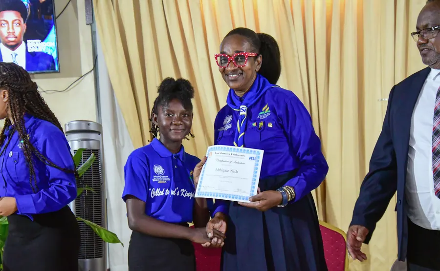 A missionary receives a certificate of induction