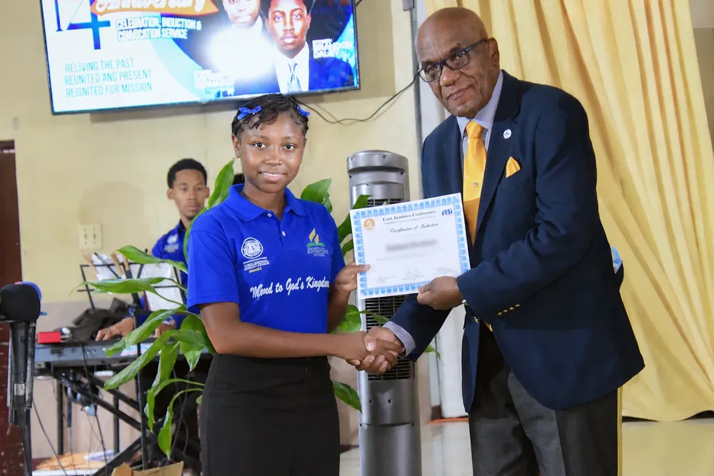 A missionary receives a certificate of induction