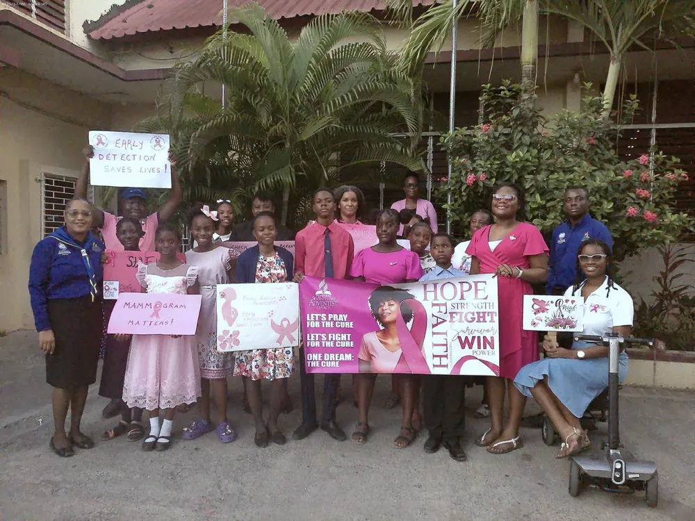 Awareness campaign group with banners and pink balloons