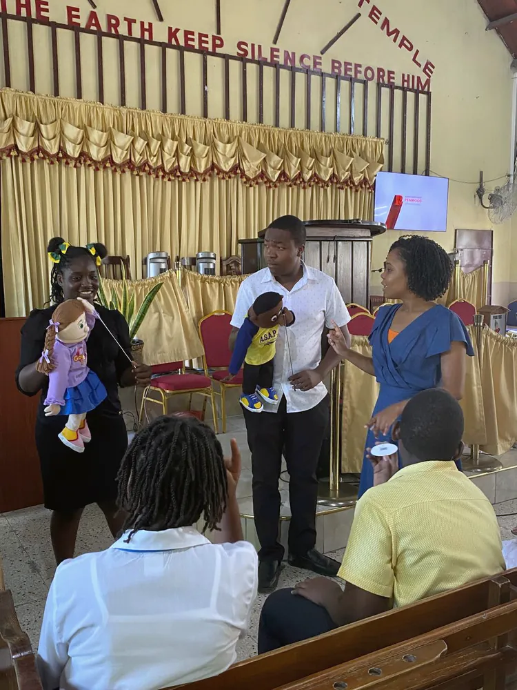 Young people presenting with puppets